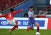 Gan Super League: lokalna piłka za 14 mld juanów w Jiangxi Gan Super League w Jiangxi i piłkarze podczas meczu otwarcia lokalnej ligi w Chinach